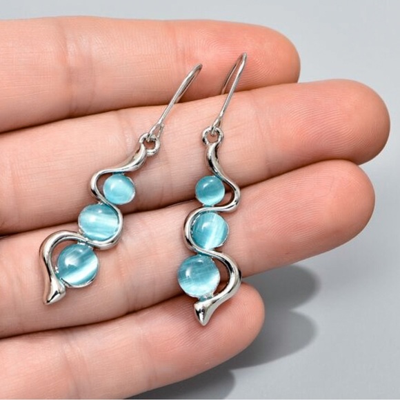 Any 4/$25! Silver Baby Blue Crystal Drop Earrings - Picture 2 of 6